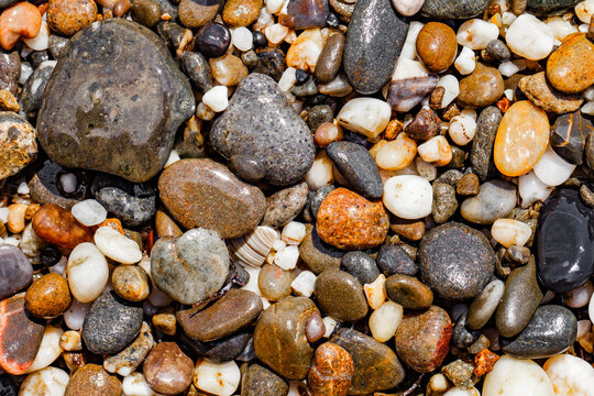 background of pebbles on the beach top view