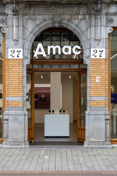 's-Hertogenbosch, Netherlands - September 30, 2026: Amac electronics store entrance in a historic city center building, with Apple products visible inside the retail space.
