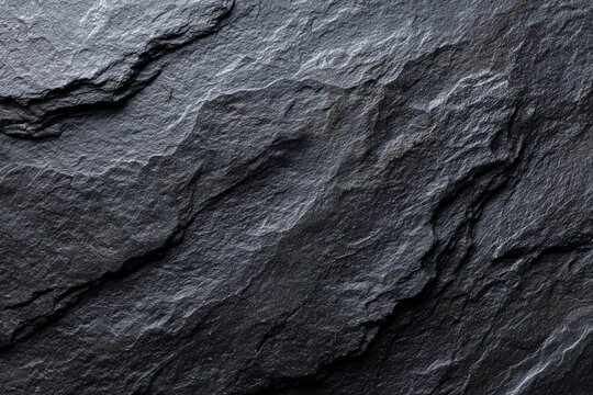 Detailed dark grey slate stone texture, natural rough rock background with uneven cracked surface pattern.