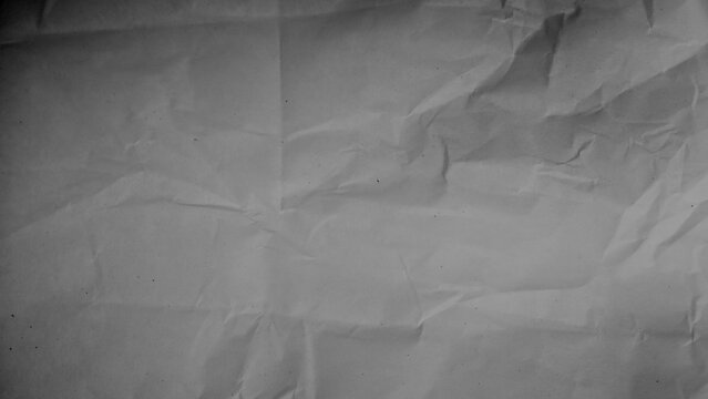 Gray crumpled paper texture effect for vintage craft background design