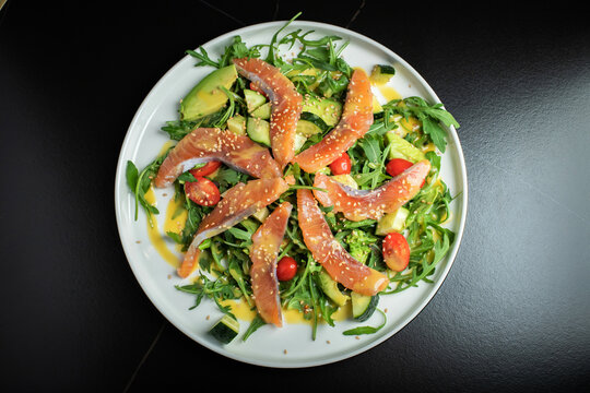 Salad with salted salmon and arugula