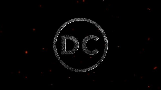 The letters dc inside a circular frame with particles and glowing embers