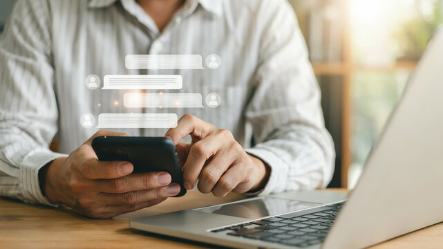 Person using smartphone with chat bubbles and user icons floating above screen messaging communication