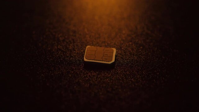 SIM Card Rotating in Warm Amber Light