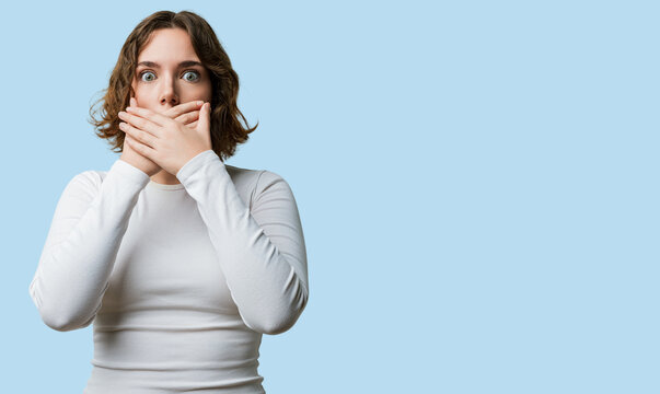 Woman casual covering mouth with hands, cover hand pressed to lips in shock after a mistake, secret revealed, shocked expression against white background