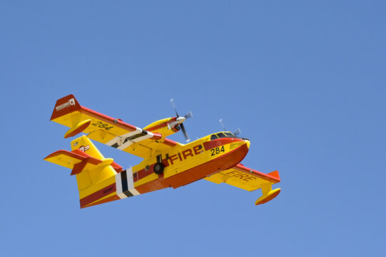 Bryce Canyon, Utah, USA - 28 June 2026:  CL-215T Super Scooper fire water bomber aircraft (number 284) climbing after take-off from Bryce Canyon airport. The aircraft is operated by Bridger Aerospace.
