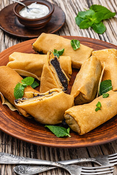 Nalysnyky thin crepes filled with poppy seed paste