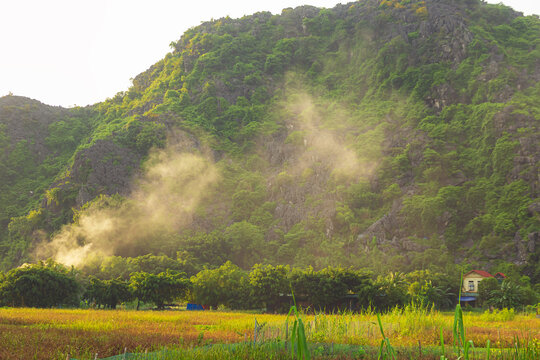 Picturesque karst landscape near Tam Coc village at sunset. Ninh Binh, Vietnam.