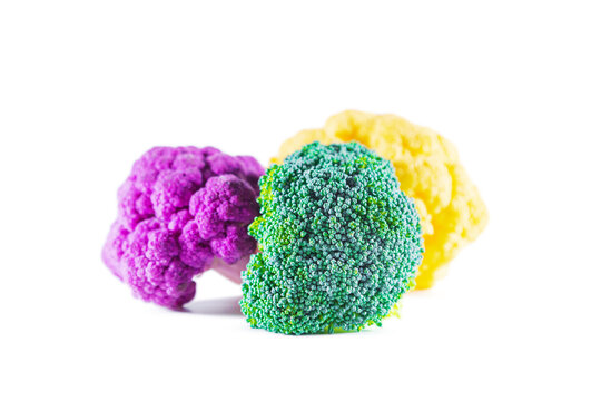 Fresh multicolored cauliflower isolated on a white background. Purple, green, and yellow florets.