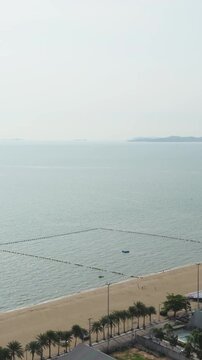 An overhead view of the endless expanse of the sea with islands on the horizon.