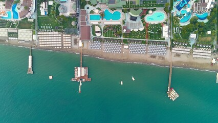 Aerial view of majestic Belek Beachfront Paradise. Sandy beaches of Mediterranean Sea. Belek Holiday Complex with five star hotels and resorts by sunset © raeva