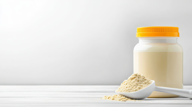 Powdered milk in container with scoop on wooden surface, showcasing clean and minimalistic design