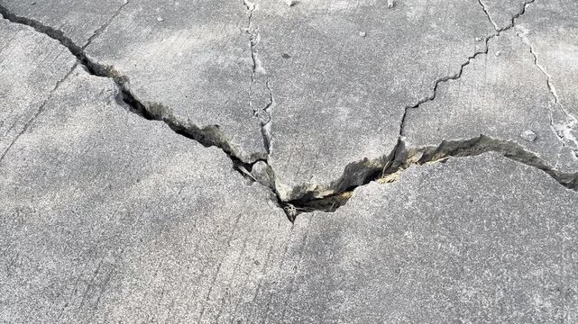 Severe cracked asphalt pavement road surface from earthquake damage