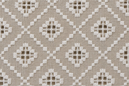 Hardanger pattern, Norwegian cutwork embroidery, textile background