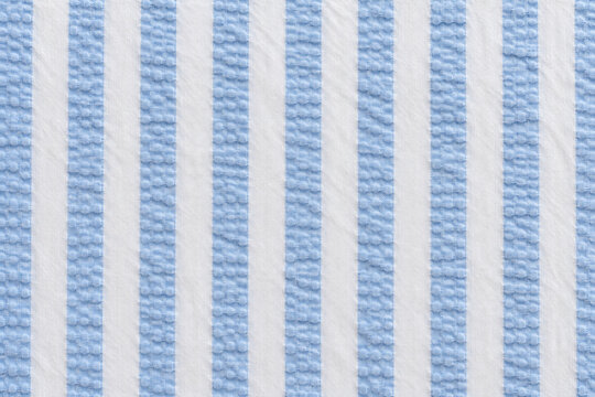Seersucker pattern, puckered blue cotton stripe, textile background