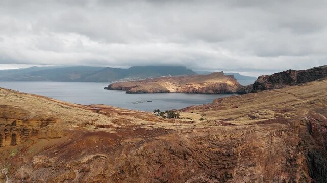 Ponta de Sao Lourenco coastal slopes above Atlantic bay, Madeira, Portugal. Drone footage island travel