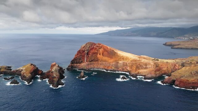 Ponta de Sao Lourenco cliffs and offshore rocks in aerial footage, Madeira, Portugal. Natural landmark and coastal tourism destination