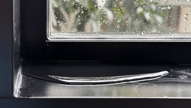 Water leaking from a condo window frame after heavy rain