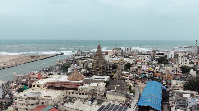 High-angle aerial drone footage showcasing the ancient Dwarkadhish Temple (Jagat Mandir) situated in the sacred city of Dwarka, Gujarat, India. 