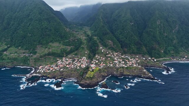 Seixal on mountainous north coast of Madeira, Portugal, aerial view. Coastal village on Atlantic Ocean shore