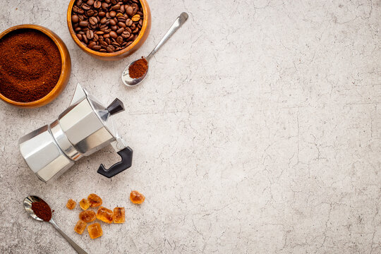 Cozy coffee brewing ritual with moka pot and caramel sugar - sweet morning coffee preparation, top view