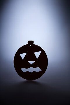 Spooky Halloween Pumpkin Ornament Silhouette on Moody Background