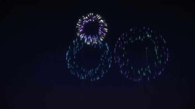Vibrant fireworks explode in the night sky, showcasing a sequence of colorful bursts and trails against the dark backdrop