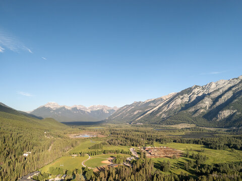 Crystal clear aerial view of Banff landscape and alpine town from above