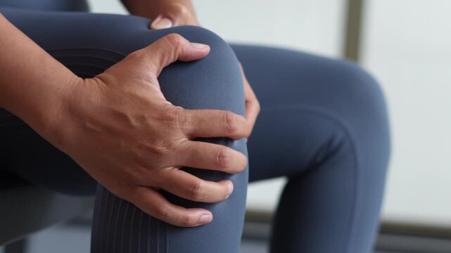 Women while exercising touching painful twisted or broken. Athlete training, running up and down stairs accident. Sport sprained sprain cause injury knee. and pain with leg bones.