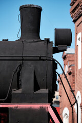 Black vintage steam locomotives with a pipe, early 20th century USSR. Museum complex of the locomotive depot Podmoskovnaya. Retro steam train.  © VLAD ANTONOV