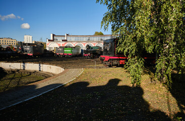 Retro steam train. Locomotive depot, railway in the city.Special circular rotating platform with rails, used for distributing locomotives within a depot and for repair purposes © VLAD ANTONOV