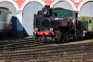 Moscow, Russia - September 30, 2026:  Locomotive depot,  vintage steam locomotives stand on special railway tracks that fan out in different directions from a single point. © VLAD ANTONOV