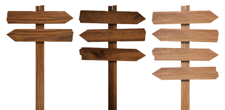 Wooden arrow signposts on metal pole with directional boards for rustic wayfinding and outdoor navigation. Trail markers with or pointer planks for parks and camping areas. Timber guidance system.