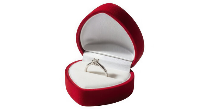 Red velvet ring box with engagement ring inside