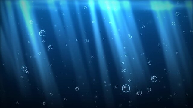 Underwater scene with sun rays and rising bubbles in deep blue ocean water