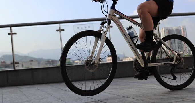  People practice wheelie in the park