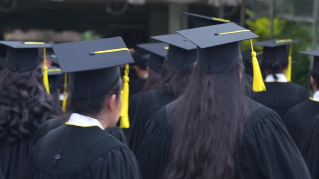 	
backside graduation hats during commencement success graduates of the university, Concept education congratulation. Graduation Ceremony ,Congratulated the graduates in University during commencement