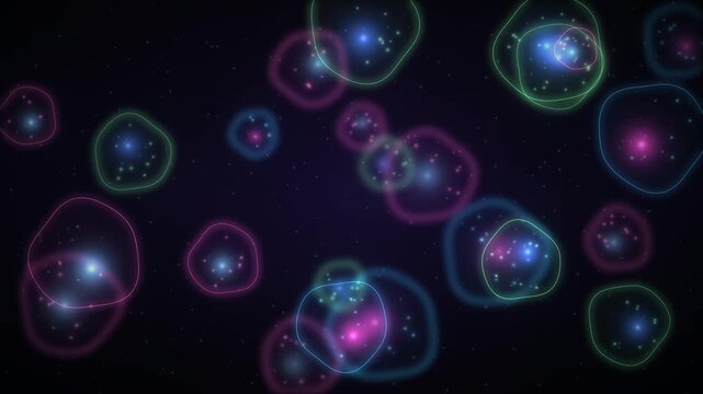 Abstract glowing orbs and particles in a dark cosmic nebula with colorful neon rings