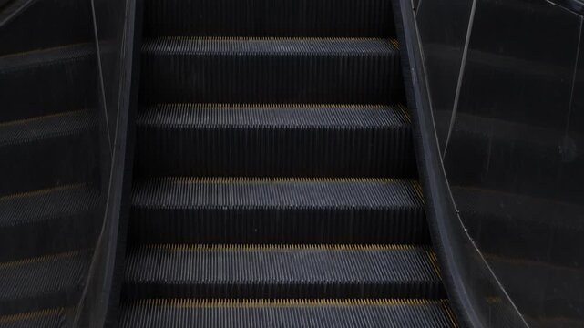 Up escalators in public building, nobody.