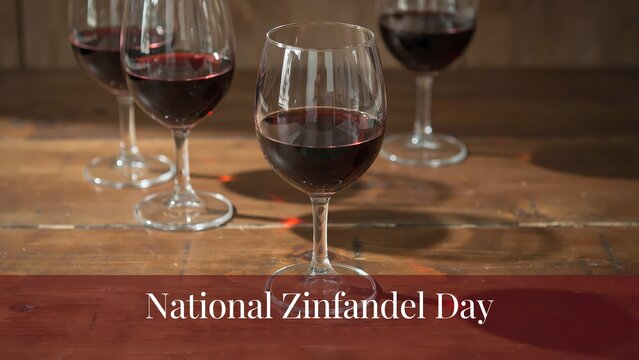 Several glasses of red wine on a wooden table for national zinfandel day celebration