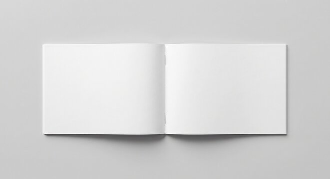 Photorealistic flat-lay of an open blank sketchbook on gray background.