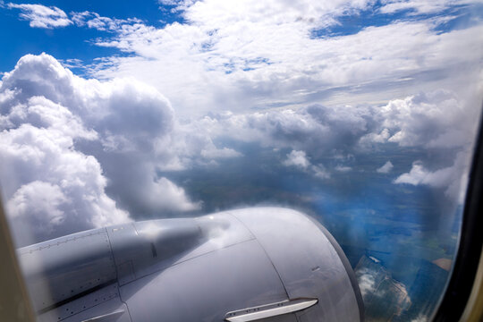View From an Airplane Flying Above the Clouds