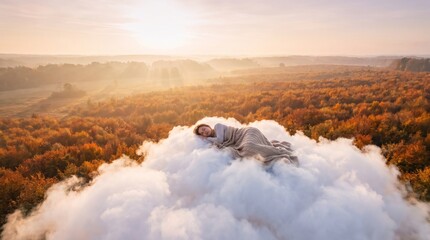 Fototapeta premium Woman sleeping peacefully on fluffy cloud above golden autumn forest
