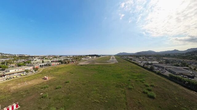 Pilot point of view final approach landing at Cannes Airport during a sunny day, aerial footage from plane, French Riviera