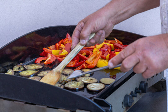 Cooking Vegetables on a Grill in a Sunny Kitchen
