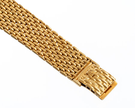 Audemars Piguet logo strap, in 18kt yellow gold with a mesh design, typical of vintage fine watchmaking. Milan, Italy, April 27, 2025.