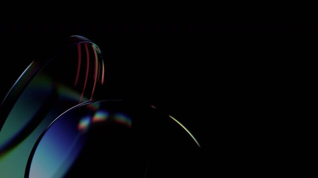 Abstract background of rotating glass iridescent circles, 4k seamless loop 3d animation