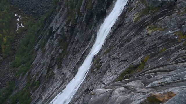 Aerial Drone View of Litlverivassforsen Waterfall Cascading Down Dramatic Granite Cliff Norway