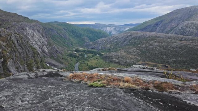 Aerial Drone Reveal of Rocky Mountain Ridge and Alpine Lake in Rago National Park Norway