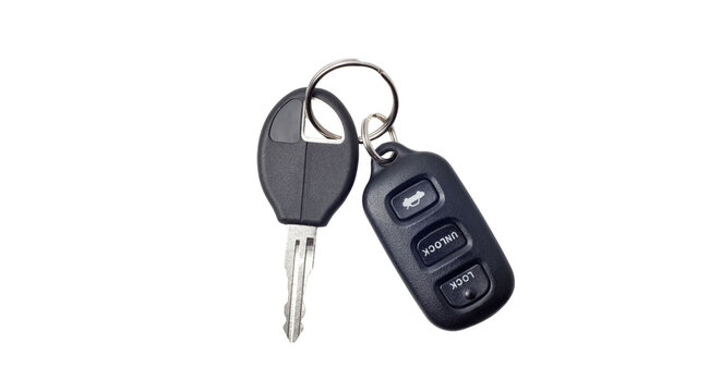 Modern car keys with remote control fob isolated on black background